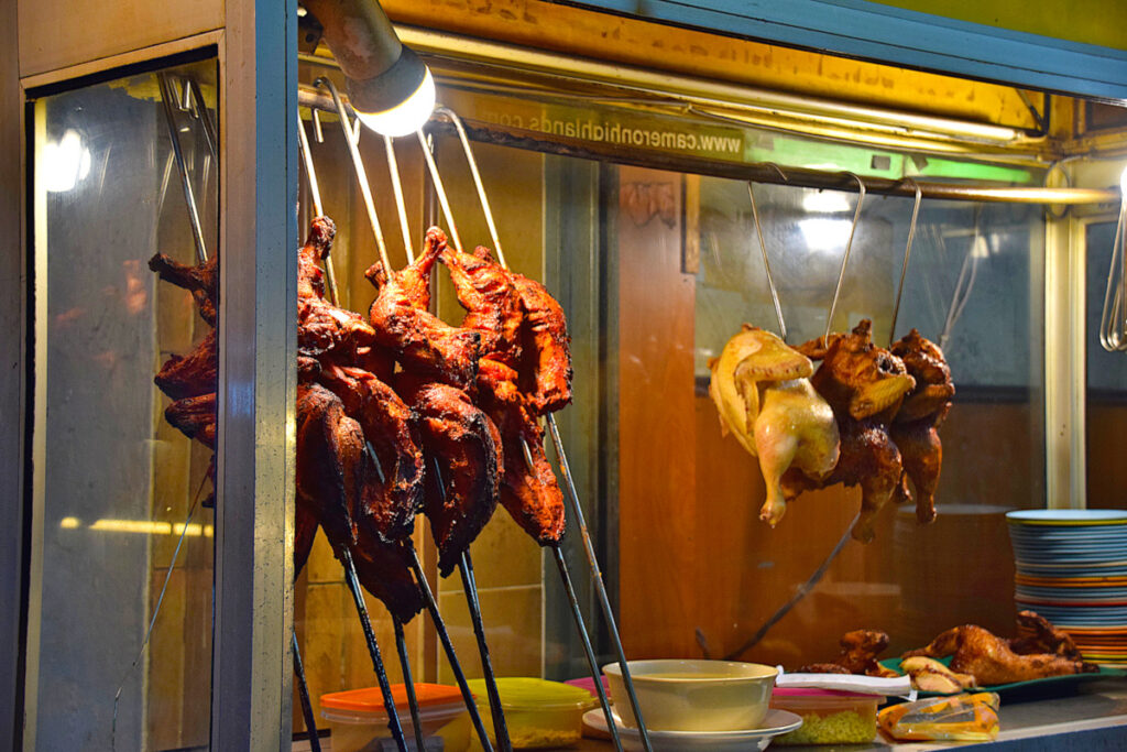 Whole cooked chickens at a stall in Tanah Rata