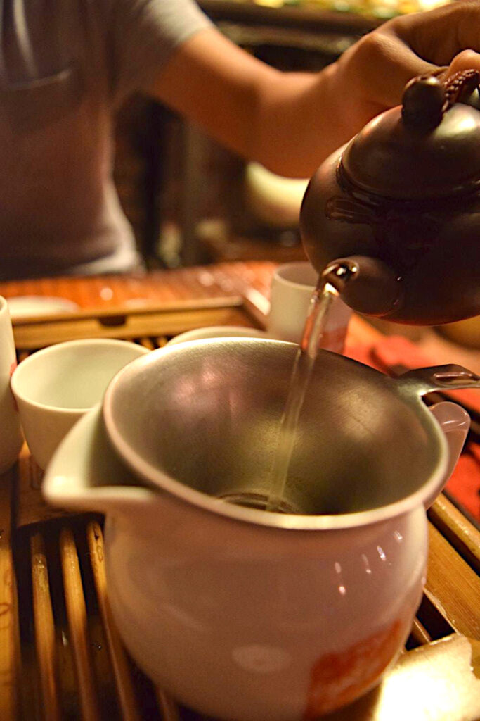 Pouring hot water from a teapot