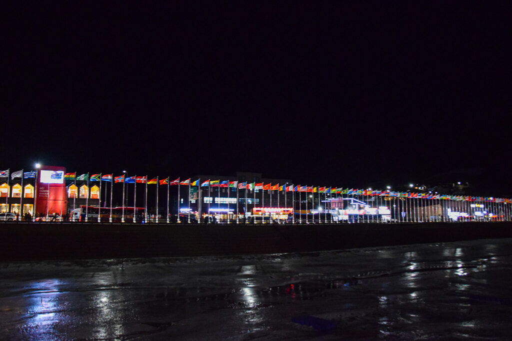 A series of country flags in the Olympic Village