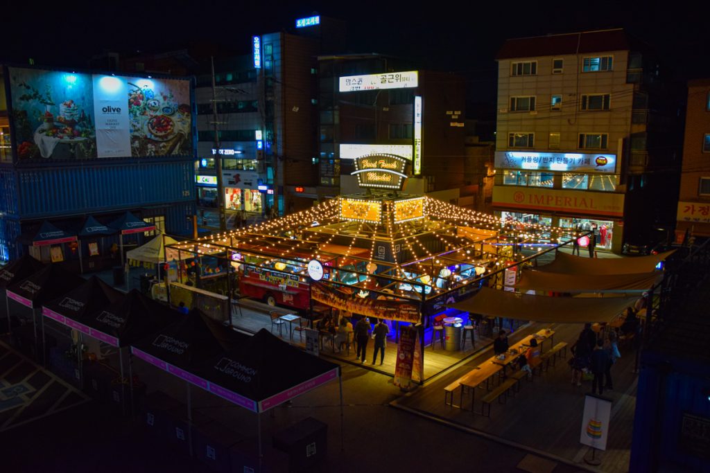 Food trucks at night at Common Ground