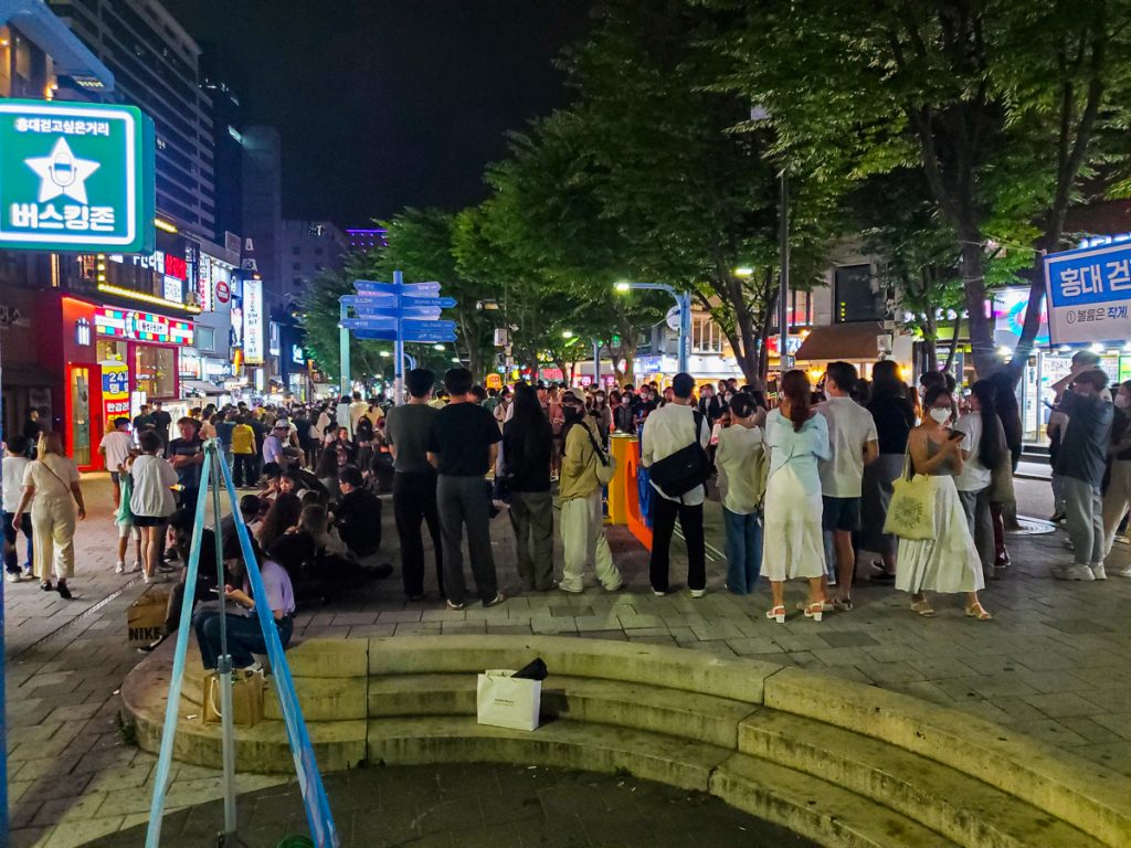 A crowd watching buskers in Hongdae